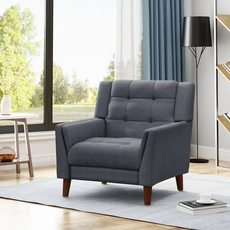 Fauteuil de club gris foncé en polyester, dossier, accoudoirs et assise capitonnés gaufrés, pieds effilés en bois de bouleau noyer, moderne du milieu du siècle