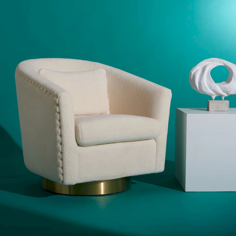 Fauteuil baignoire pivotant en velours vieux rose, capitonnage à losanges, garniture cloutée, piètement pivotant doré