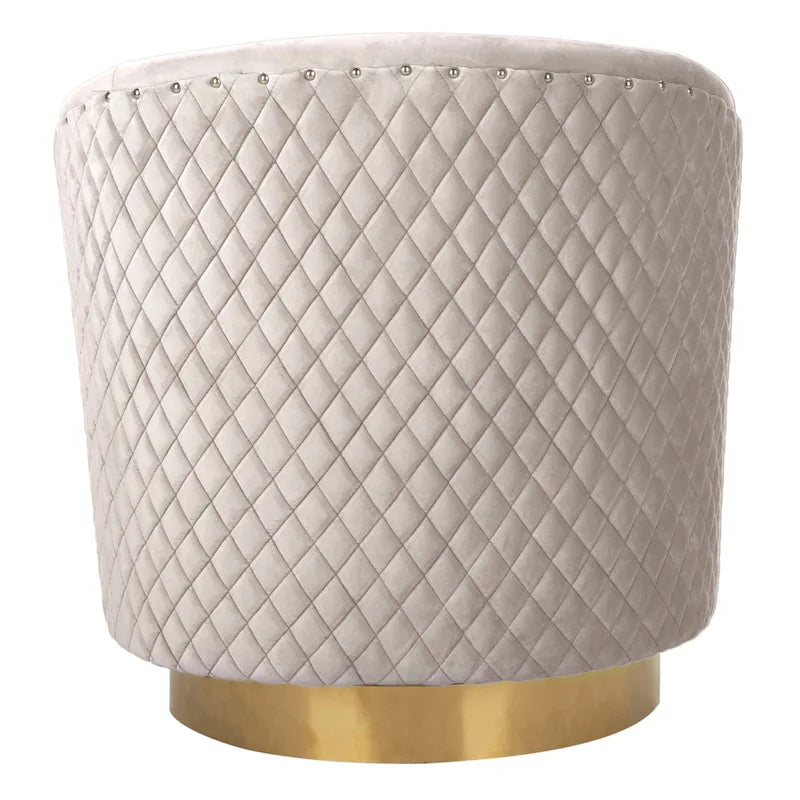 Fauteuil baignoire pivotant en velours vieux rose, capitonnage à losanges, garniture cloutée, piètement pivotant doré